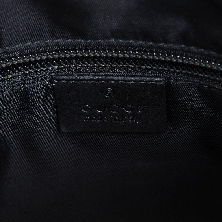 Gucci, a "Techno Canvas Web Messenger" bag.