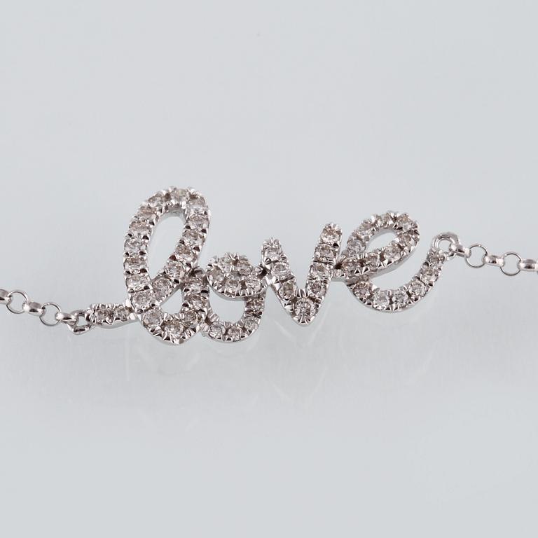 ARMBAND, 18K vitguld med briljantslipade diamanter ca 0.22 ct. Vikt 1,6 gram.