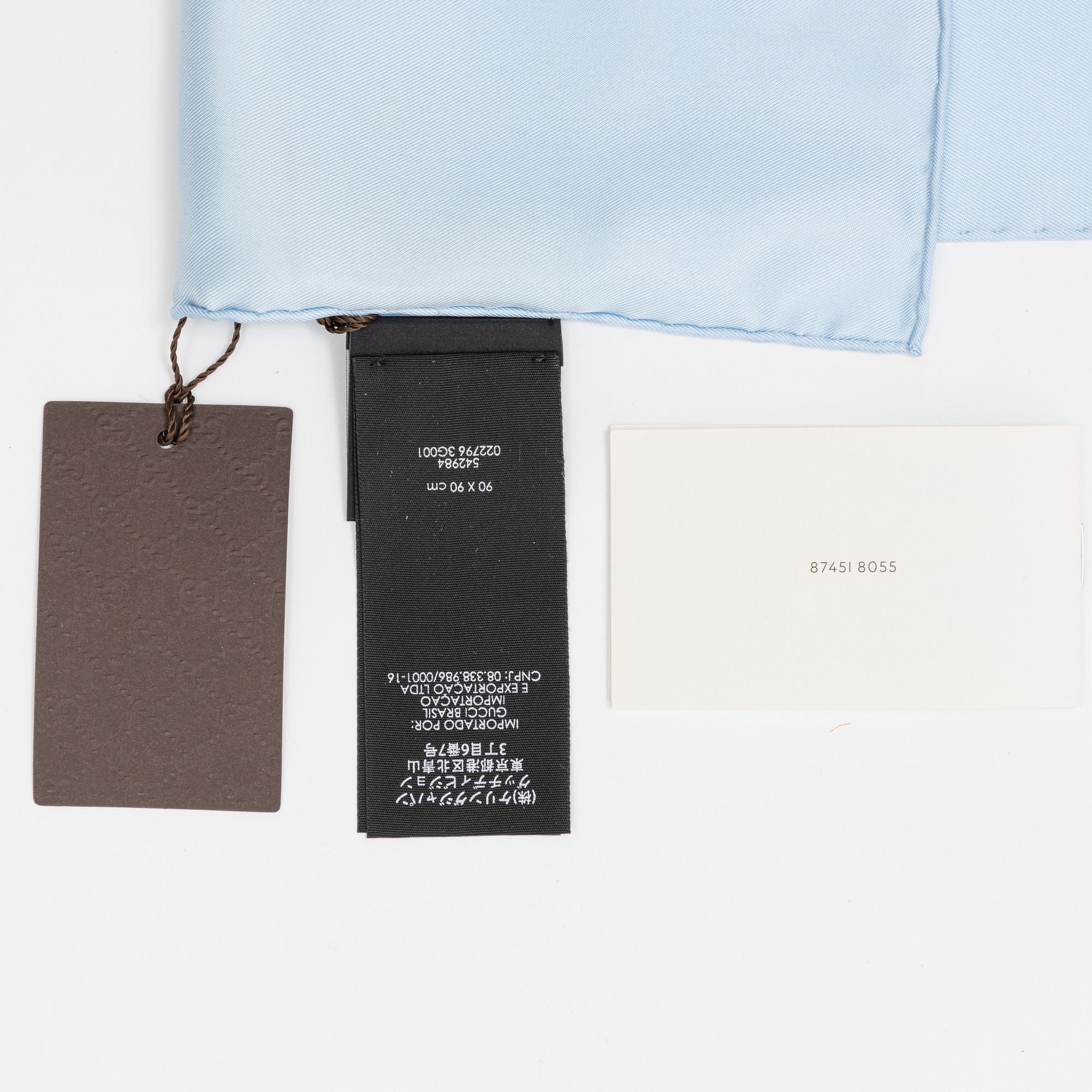 Gucci, a 'Flora' twill silk scarf.