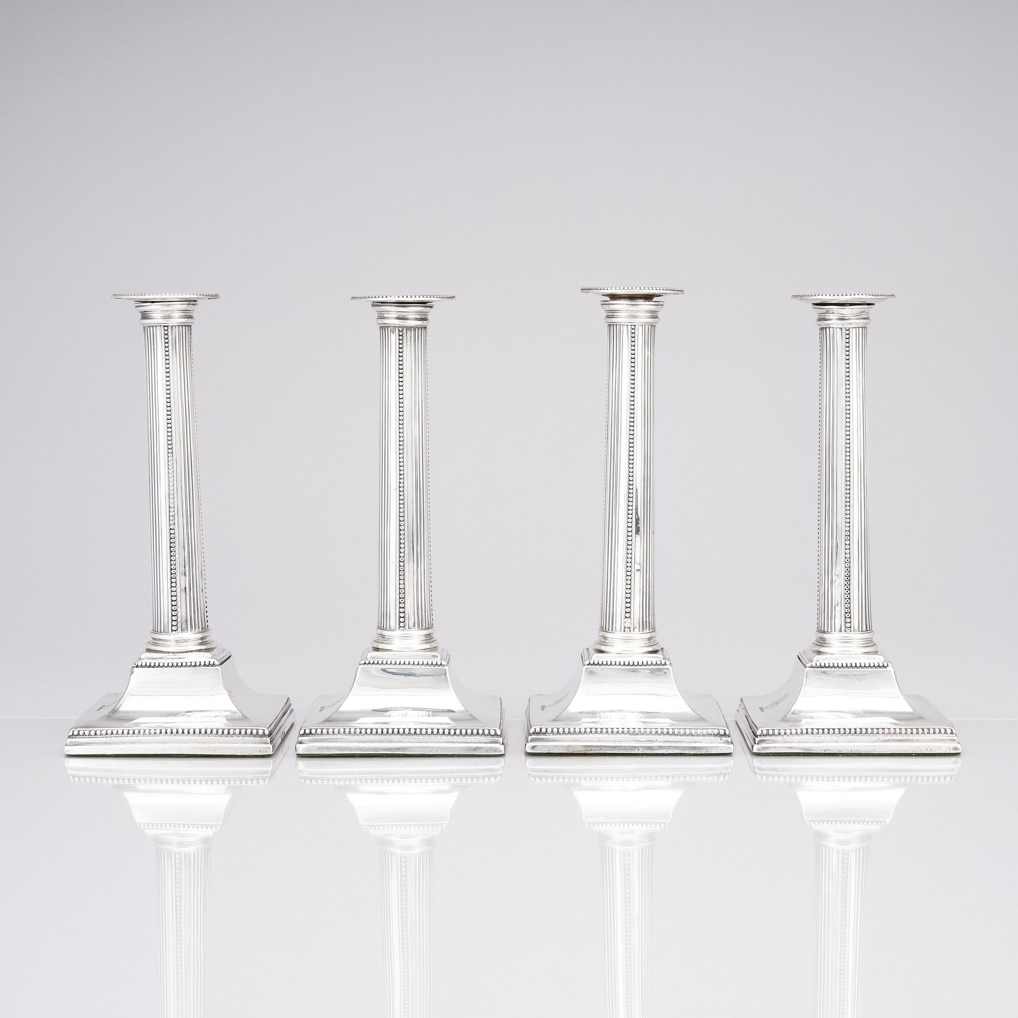 Four English 18th century silver candlesticks, mark of Young, Greaves & Hoyland, Sheffield 1780.