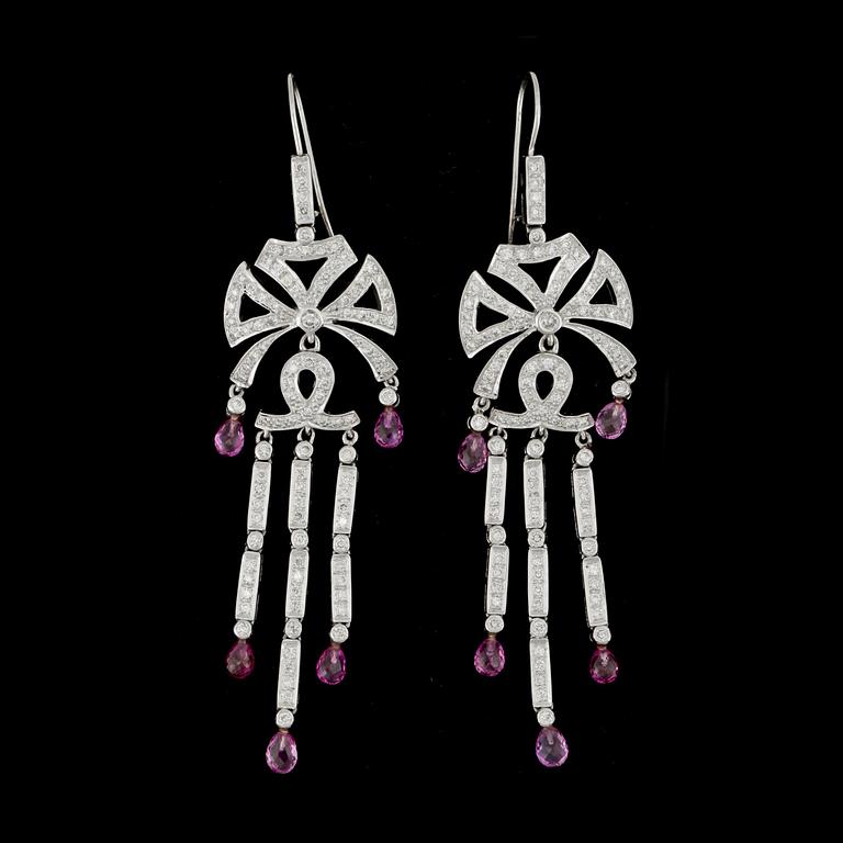 A pair of diamond and pink sapphire earrings.