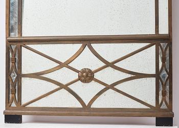 Swedish Grace, a brass framed wall mirror, 1920-30s.