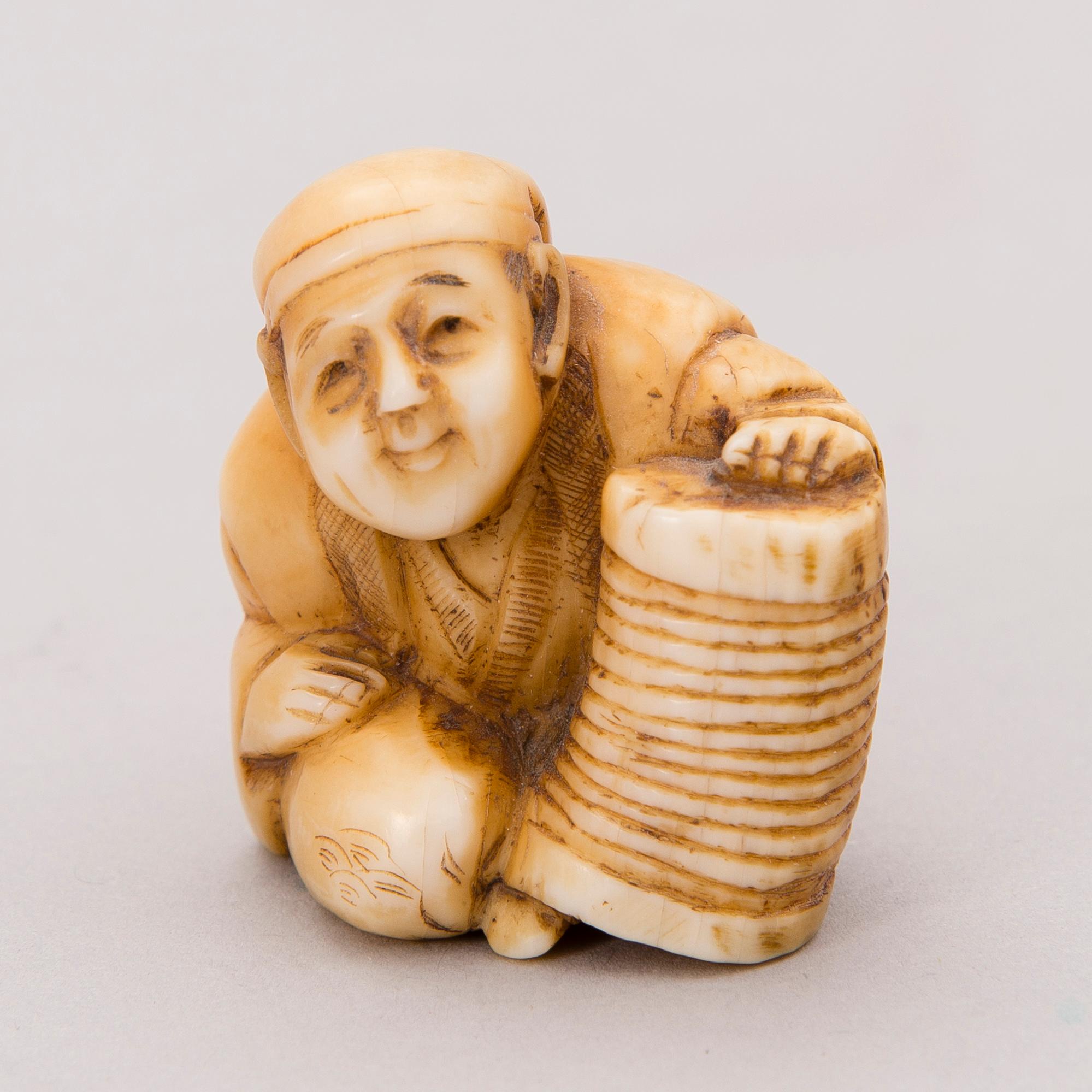 A 19th century Japanese bone netsuke.