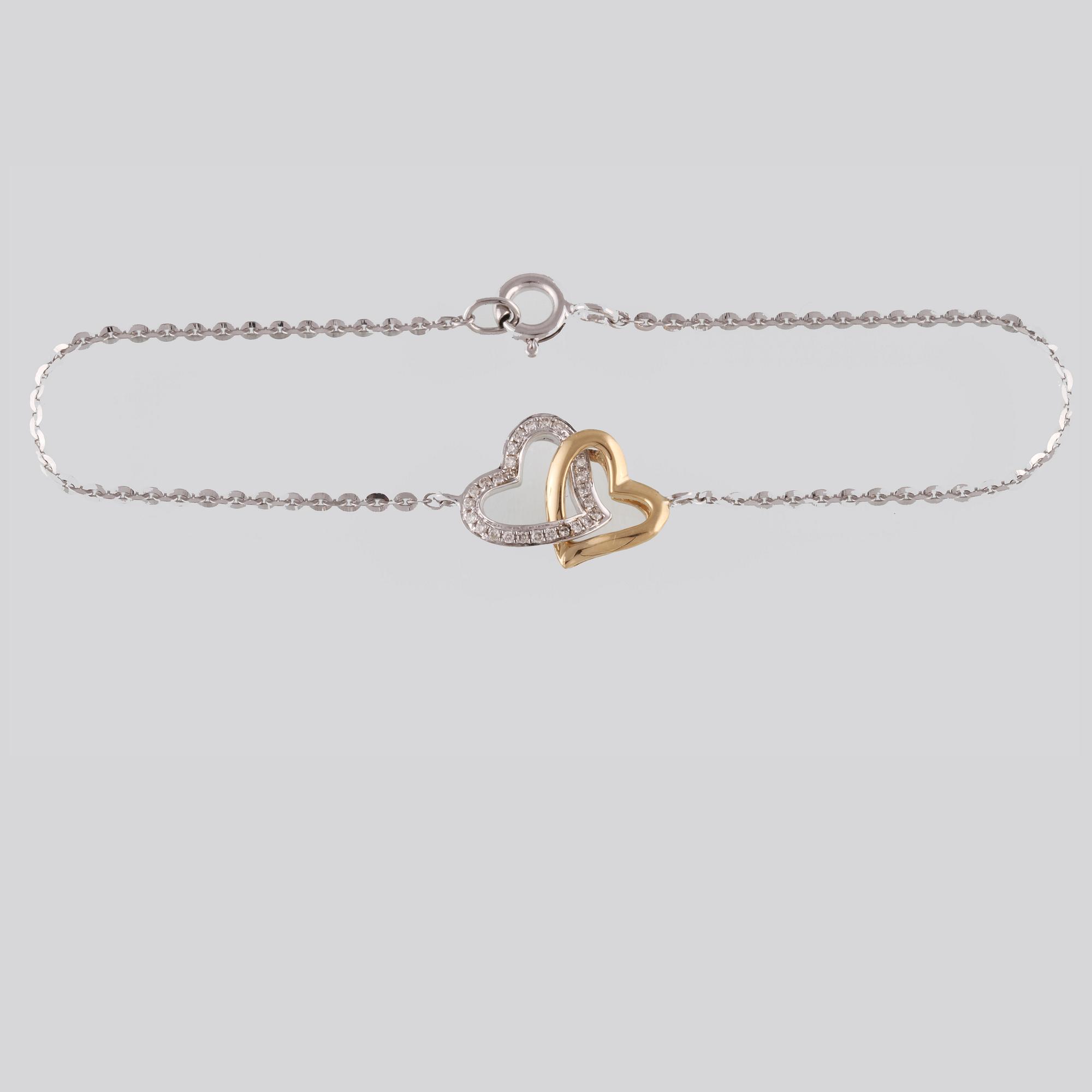 ARMBAND, 18K guld och vitguld med briljantslipade diamanter ca 0.07 ct. Vikt 2,0 gram.