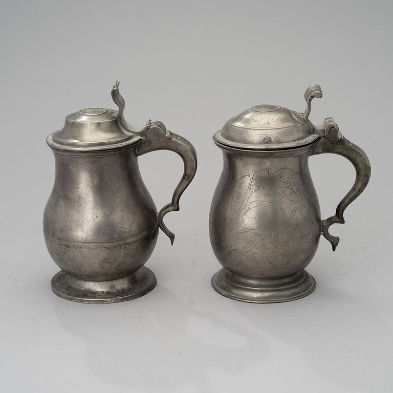 Two early 19th century pewter tankards.