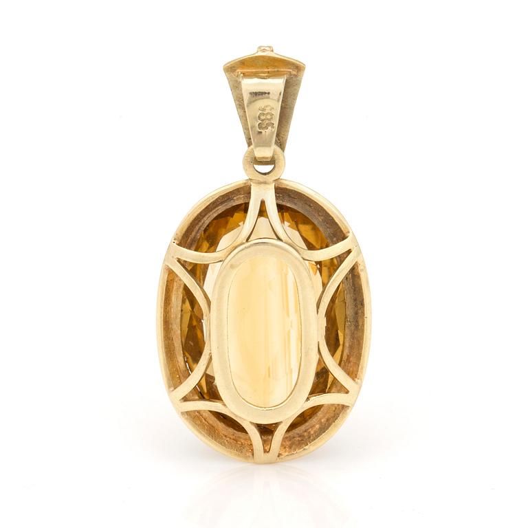A pendant set with oval, mixed-cut citrine.
