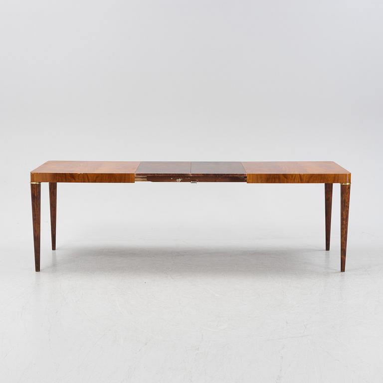 A Swedish Modern mahogany dining table, mid 20th Century.