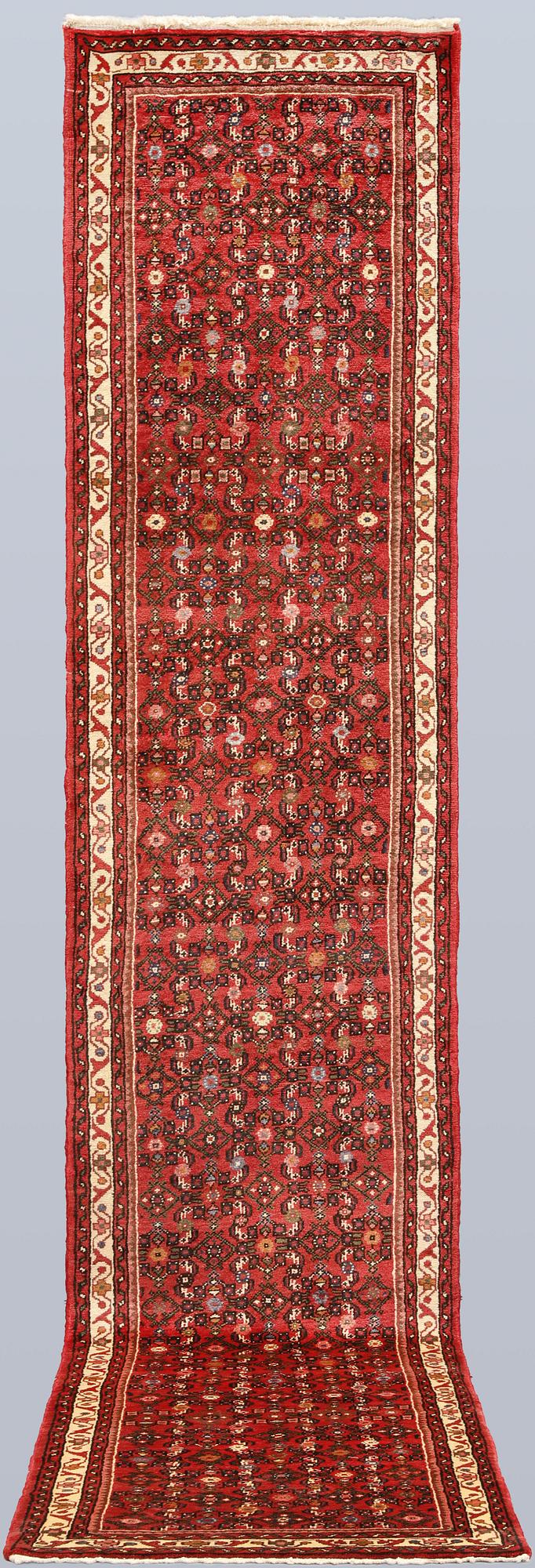 A Hosseinabad runner, c. 386 x 81 cm.