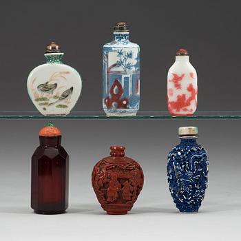 A set of six porcelain, red lacquer and glass snuff bottles, late Qing dynasty(1644-1912)/early Republic (1912-1949).