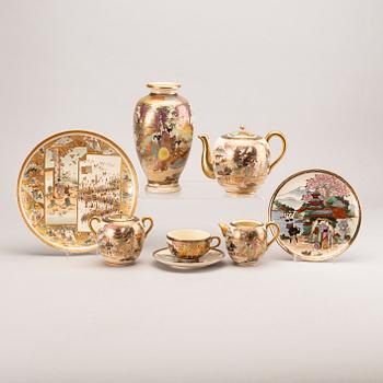 A 15+1 pcs stone ware teaservice and a vase, Japanese, around 1900.