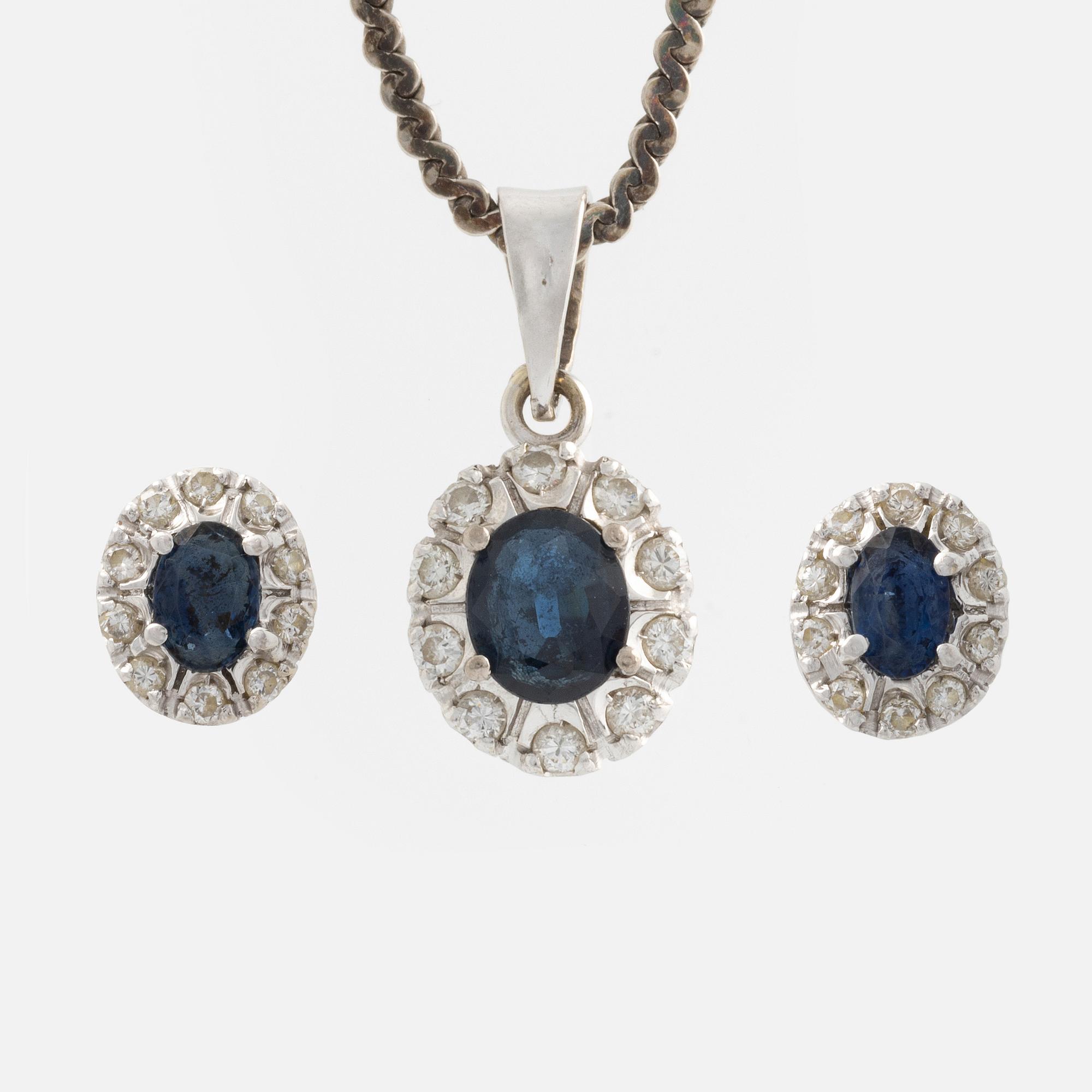 Pendant and a pair of earrings, white gold with sapphires and brilliant-cut diamonds.