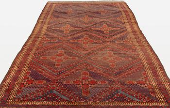 An antique Beshir carpet, ca 495 x 206 cm, around the year 1875.