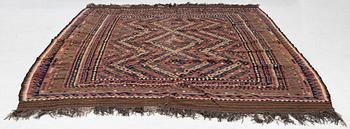A semi-antique kilim carpet, a. 385 x 251 cm.