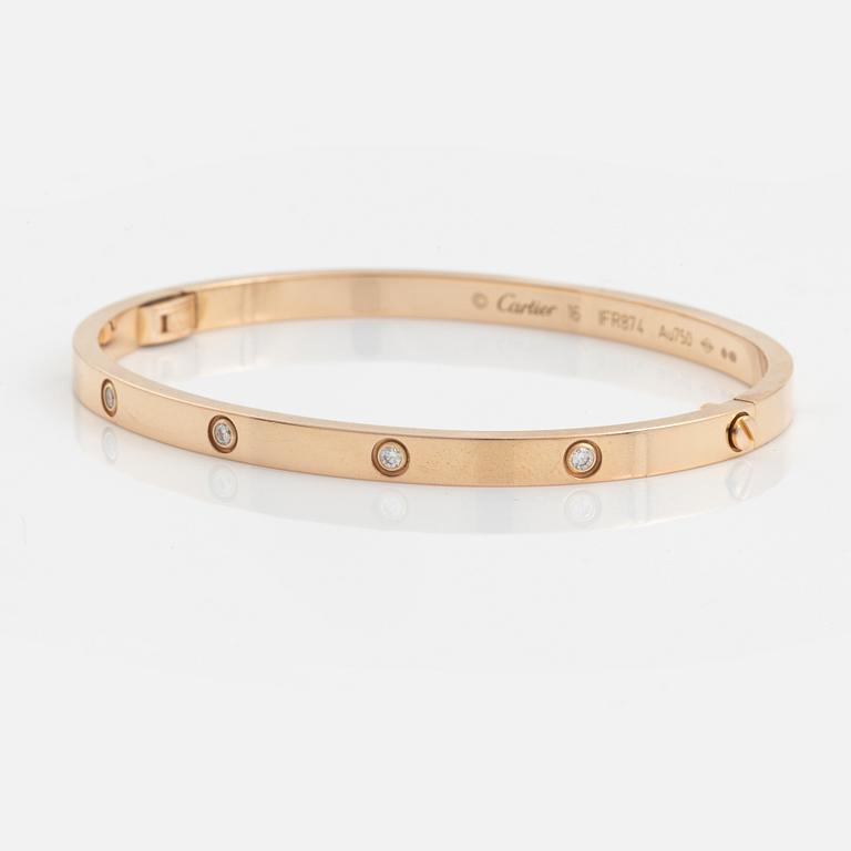 A Cartier "Love" bracelet small model in 18K rose gold with ten round brilliant-cut diamonds.