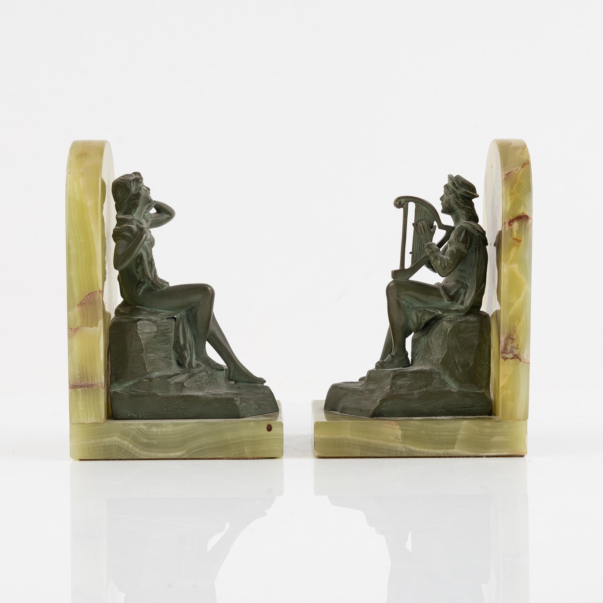 A pair of onyx and patinated bronze bookends, 1920's.
