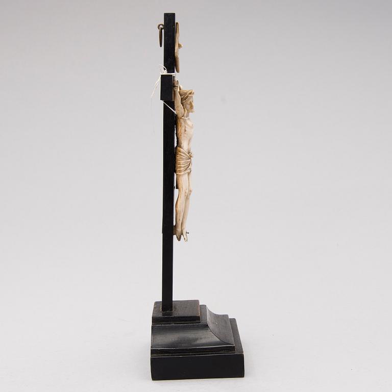 A WOODEN AND BONE TABLE CRUCIFIX with base. 19th Century.