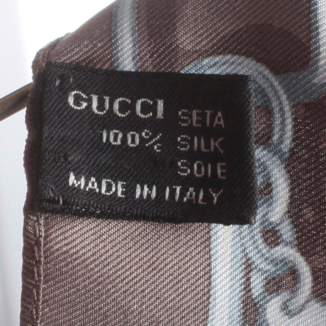 GUCCI, a grey printed silk top.