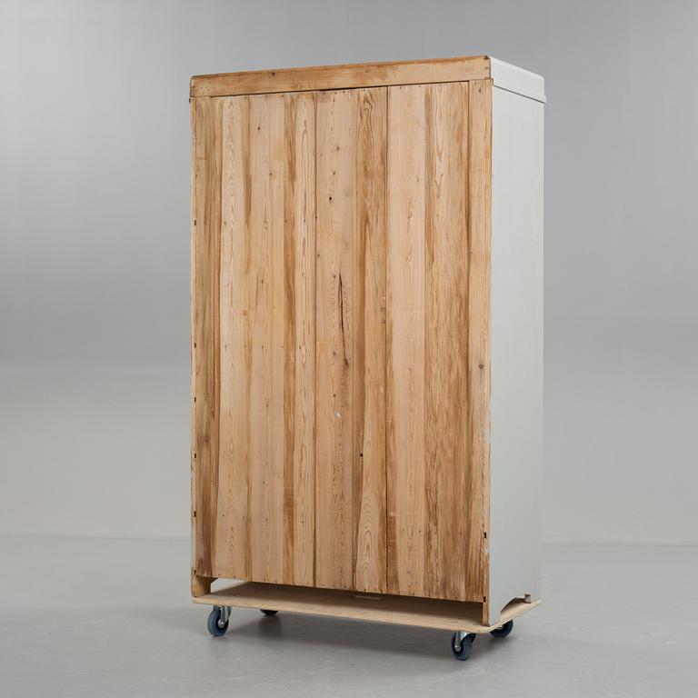 A early 20th century cabinet with mirror.