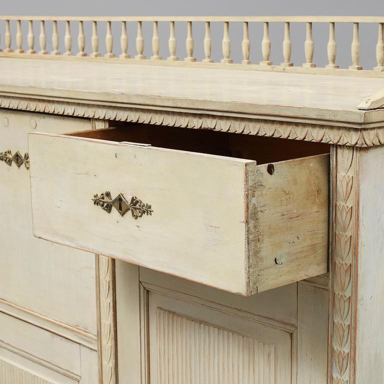 An early 19th Century painted late Gustavian cupboard.