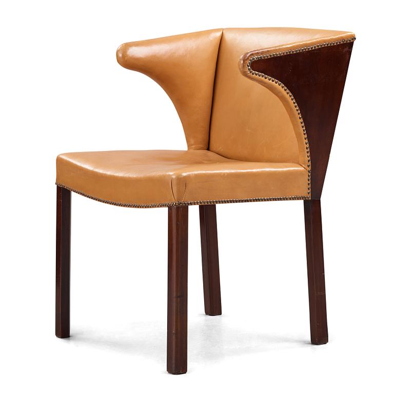 Frits Henningsen, a stained mahogany and brown leather armchair, Denmark.