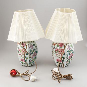 A pair of Chinese famille rose vases, turned into table lamps, 20th century.