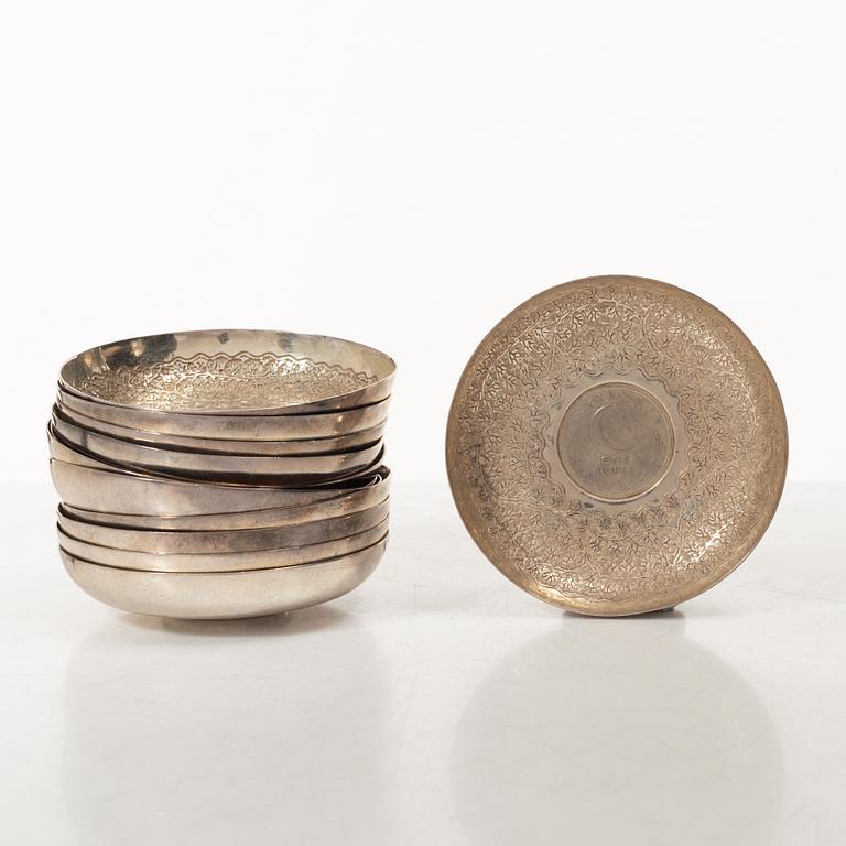 12 silver ashtrays with inlaid coins, silver, Pakistan, mid 20th century.