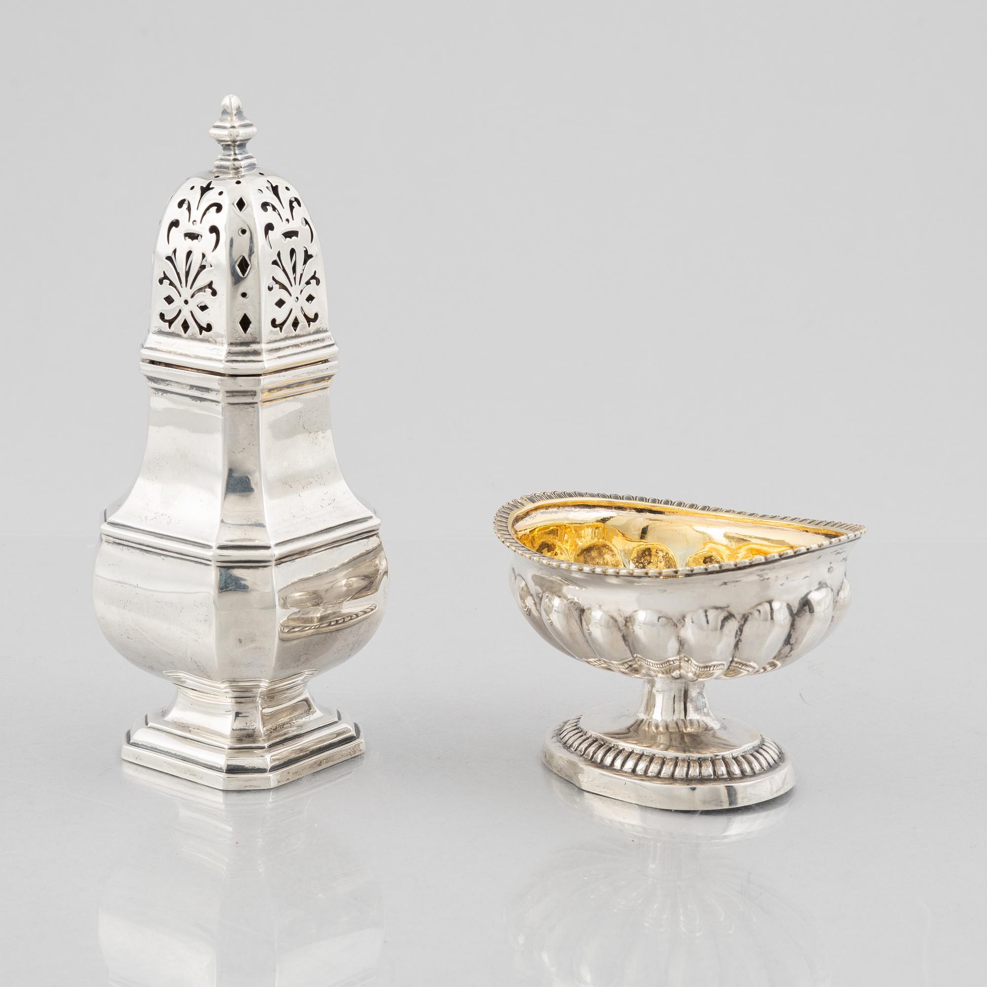 A silver sugar caster from E. S. Barnsley & Co, Birmingham,  1914, and a silver salt cellar with indistinct marks.