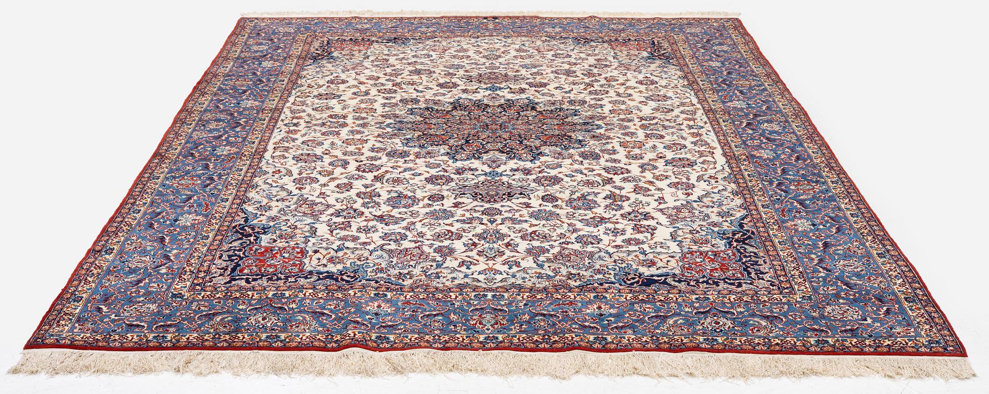 A semi-antique Isfahan carpet, Central Persia, signed (Ali) Seirafian, 328 x 250 cm.