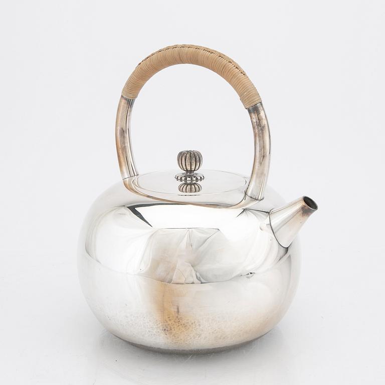 A Japanese early 20th century sterling silver tea pot.