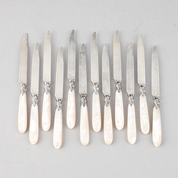 A set of twelv Louis XV-style silver and mother of pearl knifs. Paris 19th century.