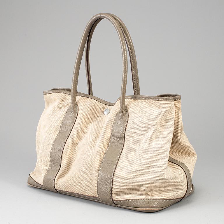 HERMÈS, a canvas and leather 'Garden Party' bag.