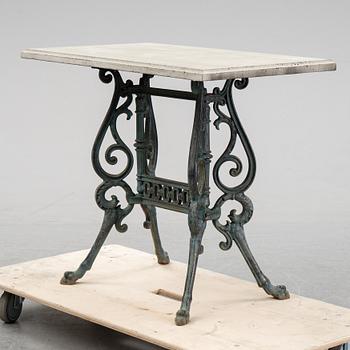 A early 20th Century cast iron garden table with later concrete top.