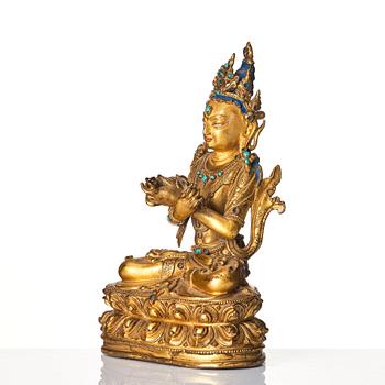 A gilt-bronze figure of Vajradhara
Tibet, circa 16th century.