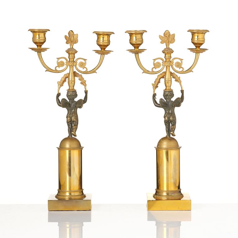 A pair of Empire gilt-brass two-branch candelabra, Stockholm, early 19th century.