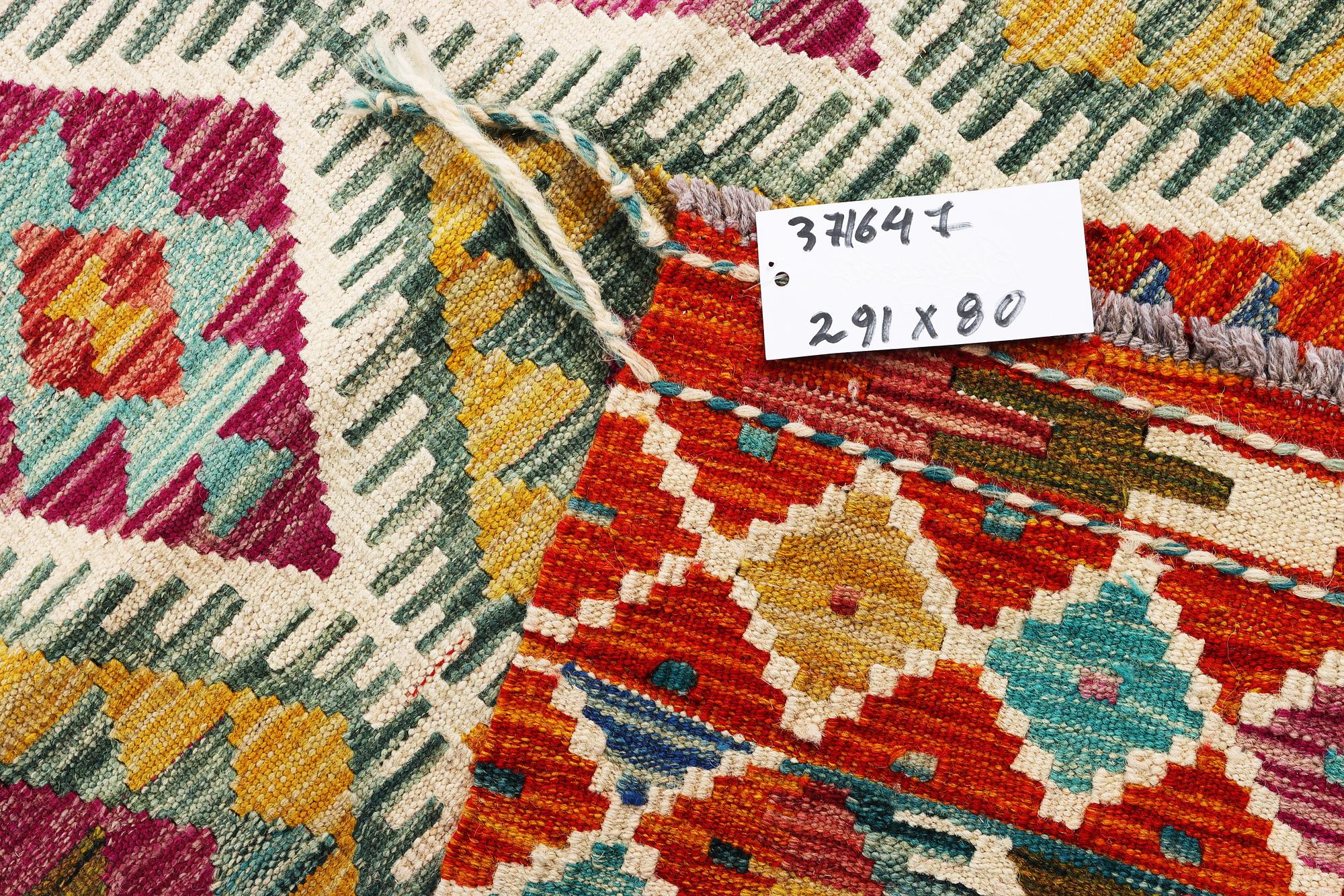 A Kilim runner carpet, c. 291 x 80 cm.