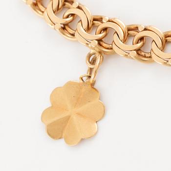 Bracelet 18K gold with charms.