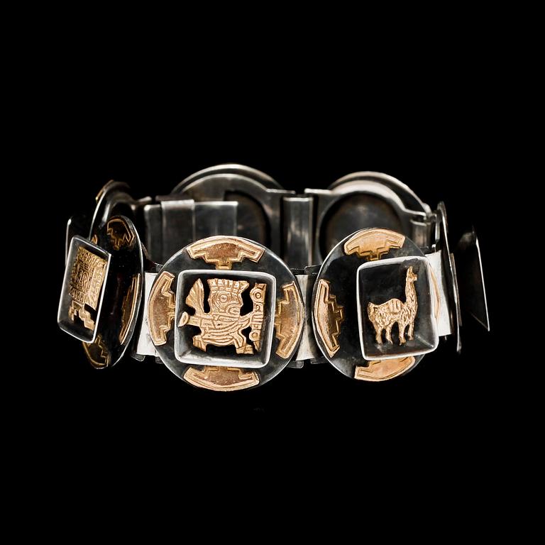 ARMBAND, silver detaljer i 18k guld. 1900-talets andra hälft. Vikt tot 47,5 g.