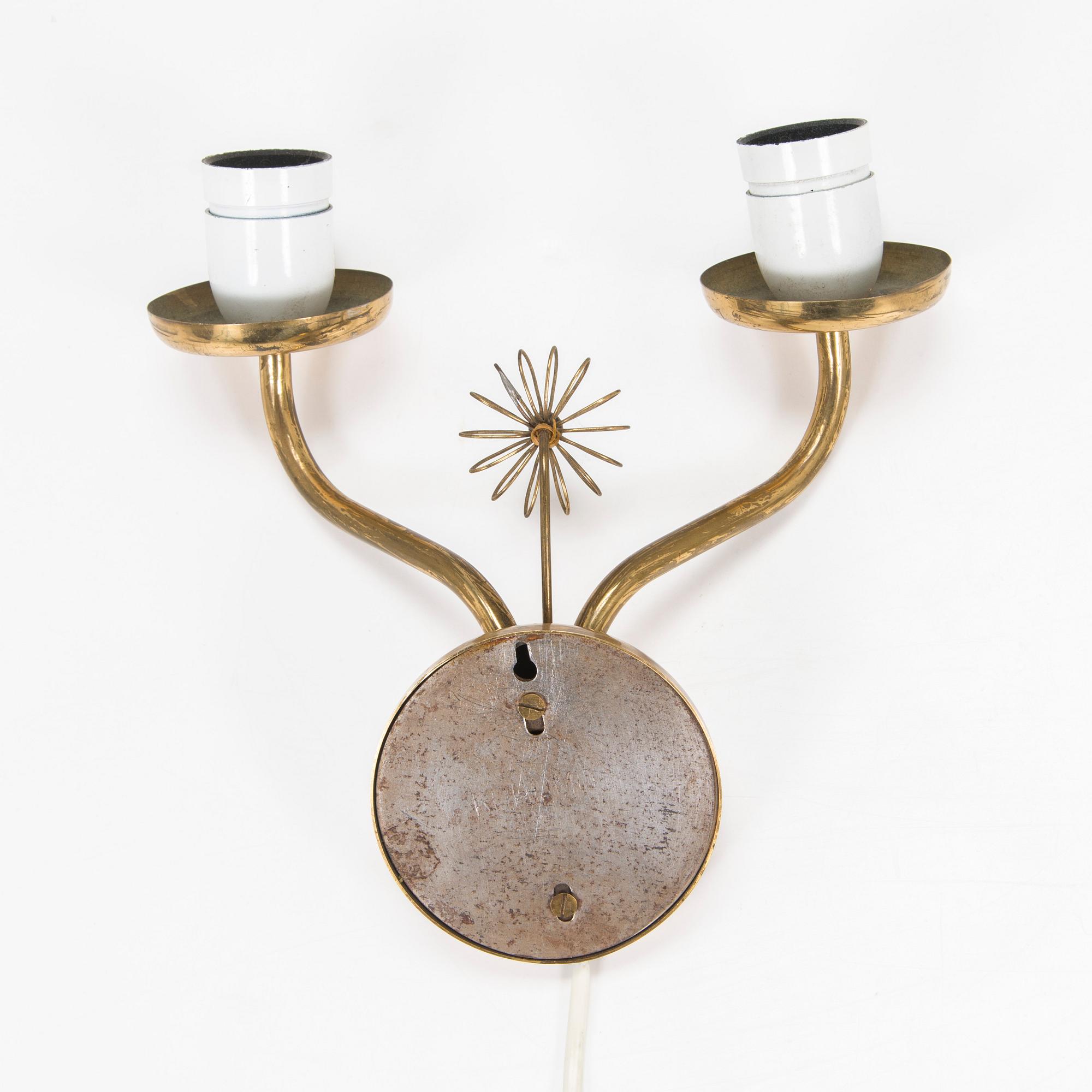 A mid-20th century wall light for Korumo.