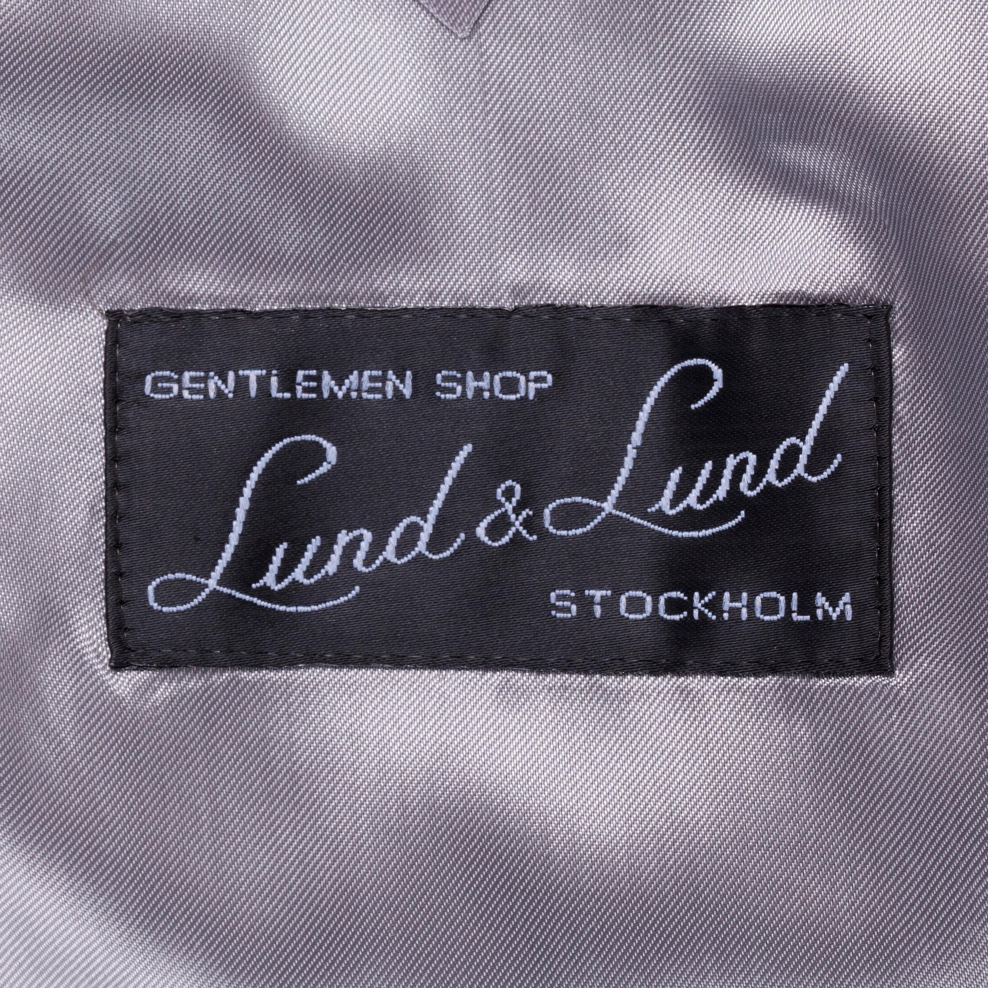 EDUARD DRESSLER, a blue wool suit consisting of jacket and pants. Size 48.