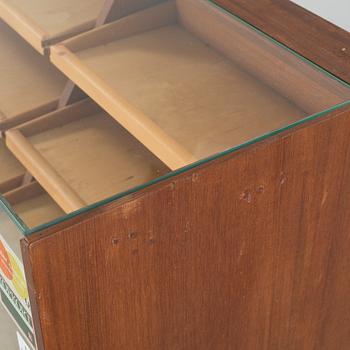 A circa mid 20th century store counter.