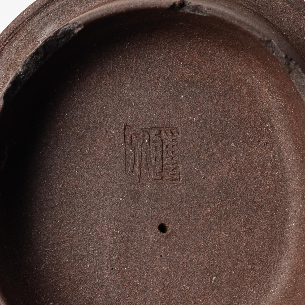 A Chinese 'hundred-fruit' yixing teapot, Qing dynasty (1644-1912).