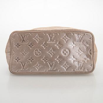 Louis Vuitton, a shimmer 'Halo' bag.