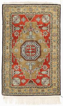 A rug, silk Quum, ca 121 x 76 cm.