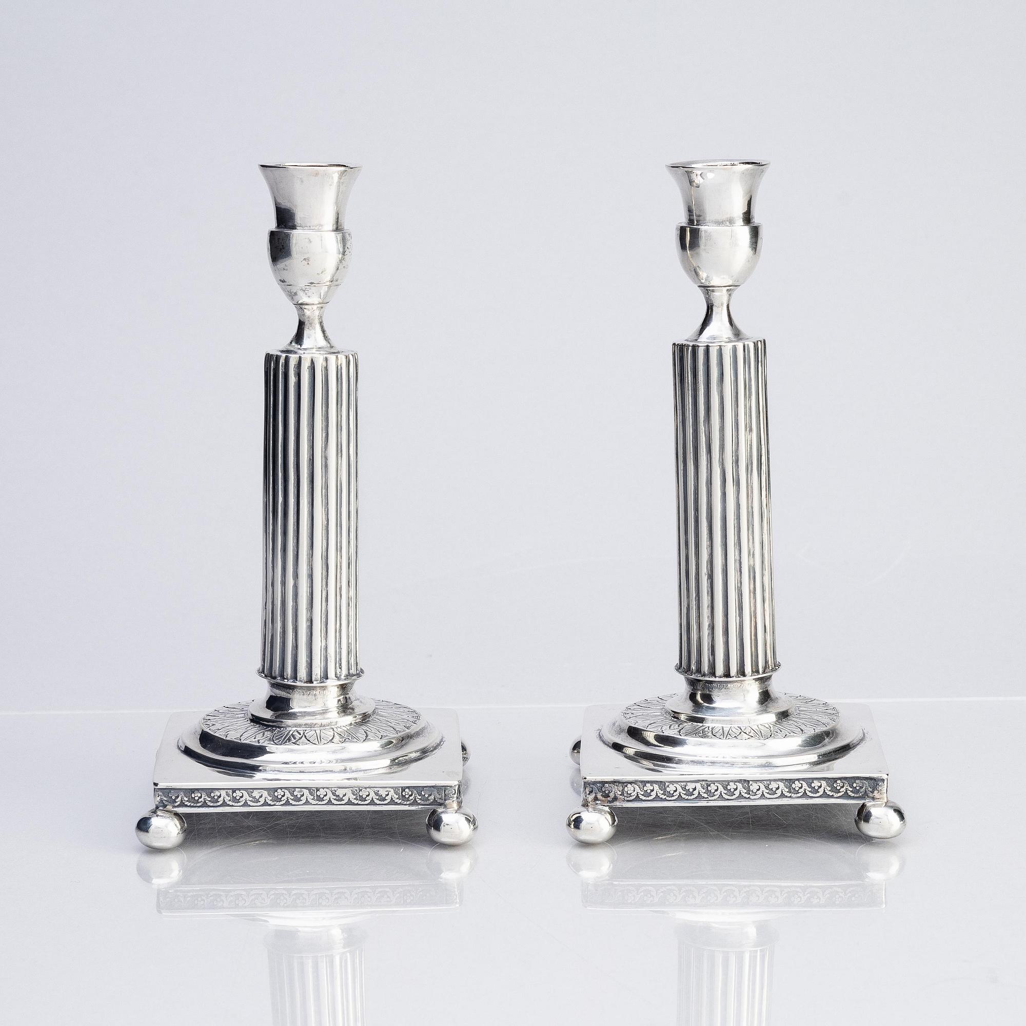 A pair of Gustavian silver candlesticks, unclear maker's mark, the cuffs with mark of Pehr Zethelius, Stockholm 1796.