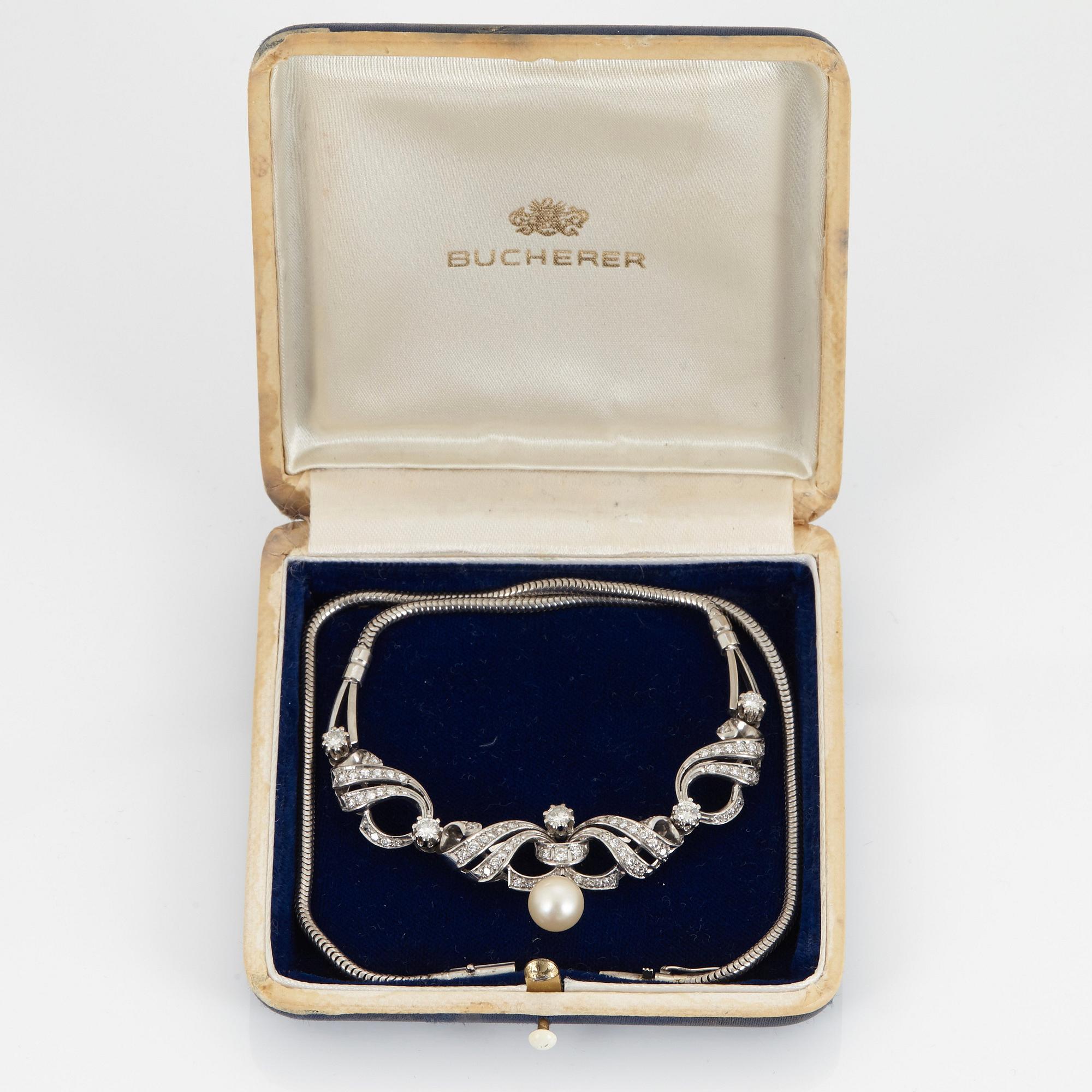 A NECKLACE set with round brilliant-cut diamonds and cultured pearls.