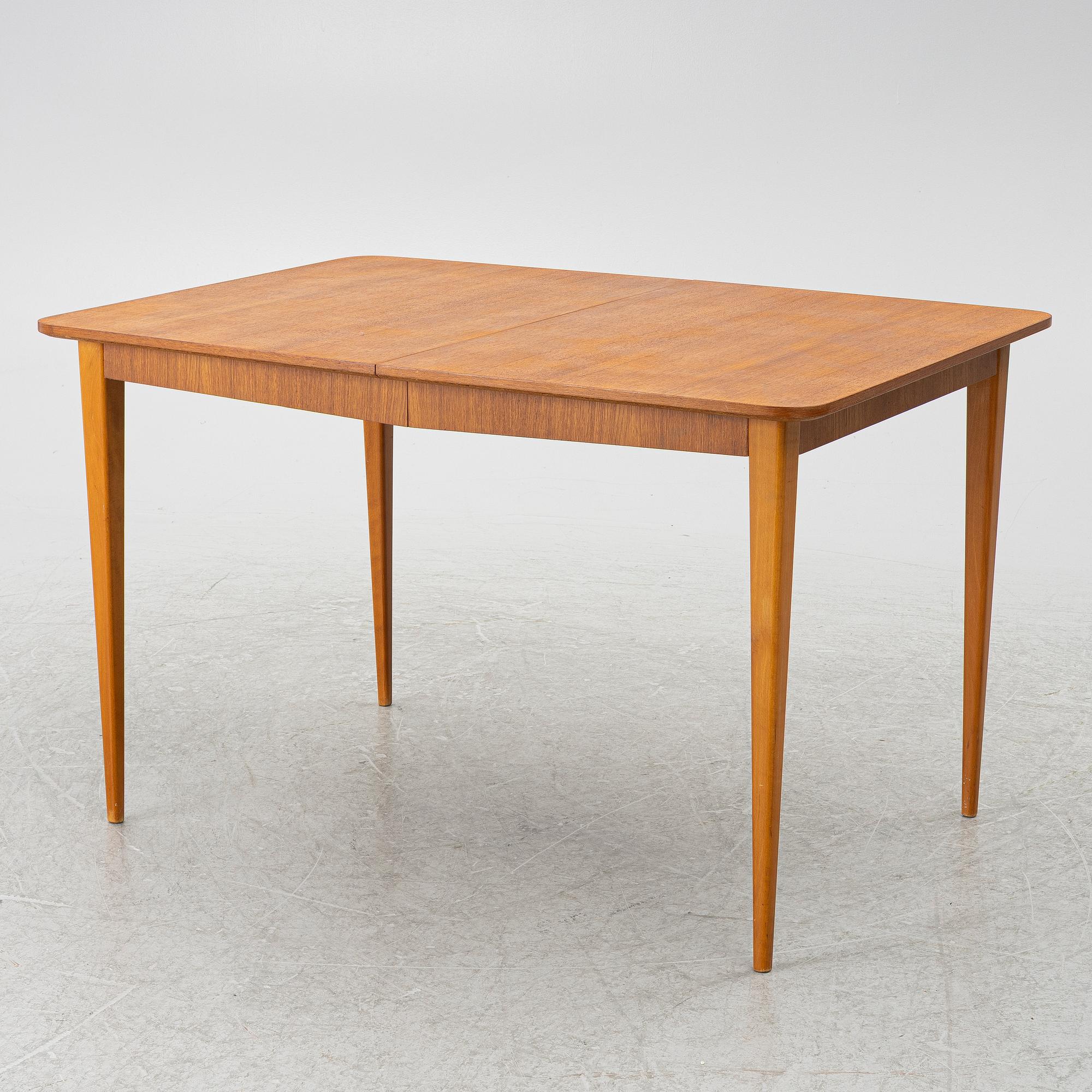 A mid20th century dining table.