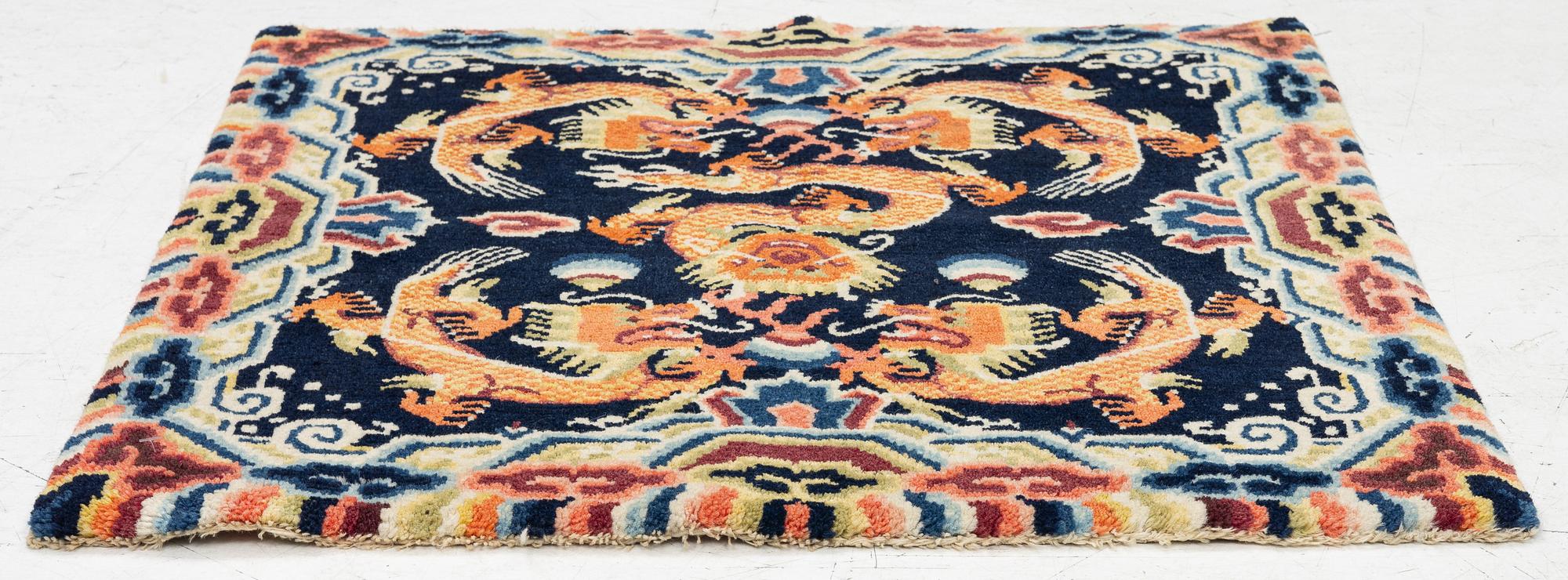 A Chinese small square rug, semi-antique, 65 x 68 cm.