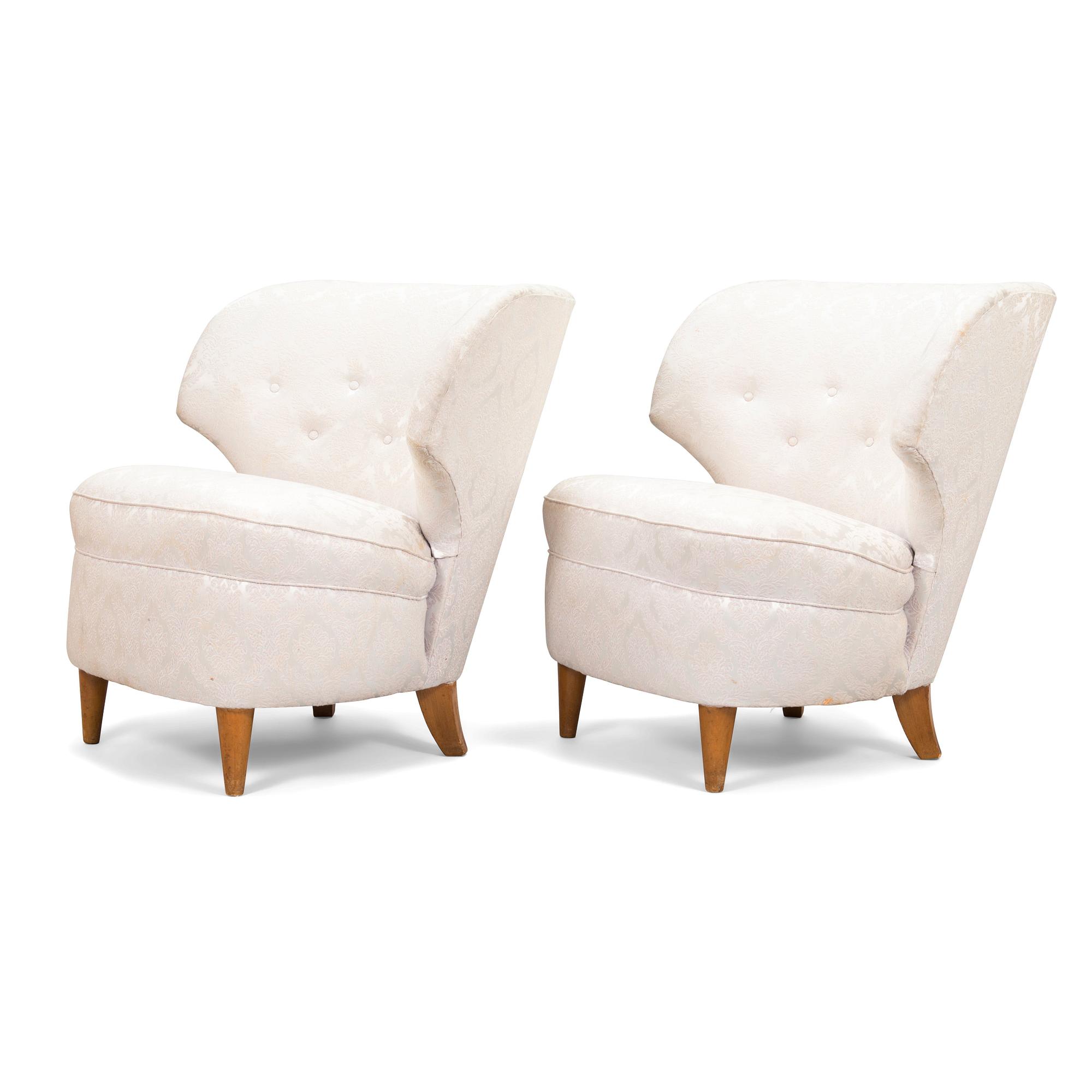 A pair of 1950's armchairs.