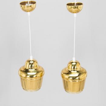 Alvar Aalto, A pair of  A 330, 'Golden Bell' pendant lights A330 for Artek, 2000s.