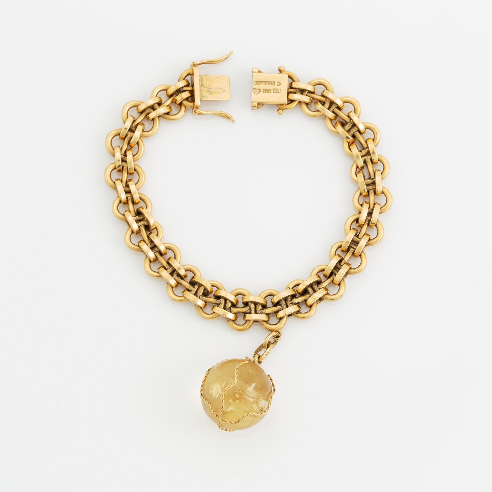 Claës E. Giertta, armband 18K guld med berlock med citrin.